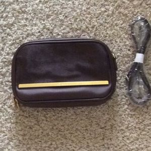 Brown faux leather and cow hair crossbody clutch